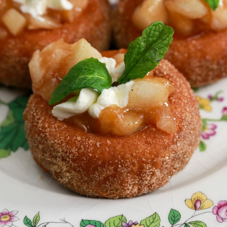 Maple donut with caramelised apple sauce on white floral plate