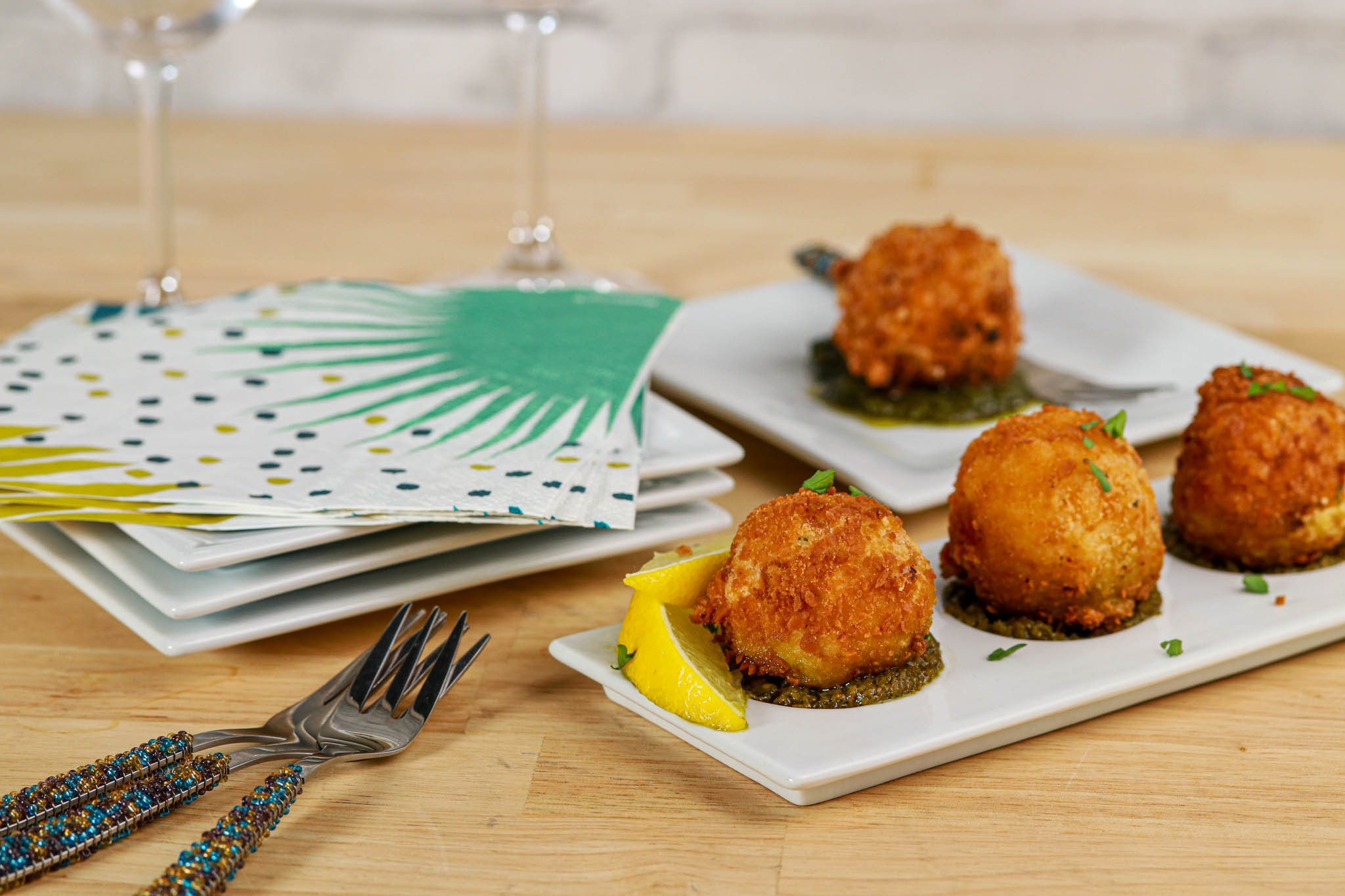 Gluten-free Panko crusted Arancini balls in white dish 